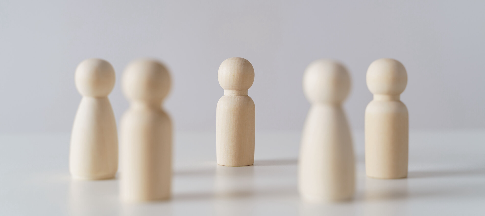 Wooden figures on white background